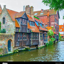 A canal lined with historic buildings in Bruges, Belgium