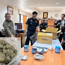 Law enforcement examining a shipment suspected of illegal trafficking