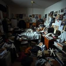 A disorderly room with objects scattered around.
