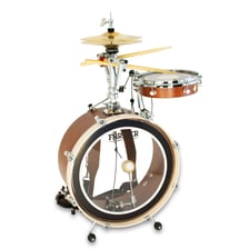 A drum kit showing a drum positioned beside a hi-hat cymbal.