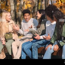 A person sharing a short, engaging story with a small group of listeners.