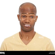 A person displaying an unimpressed facial expression.