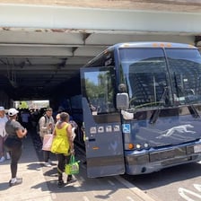 A Greyhound intercity bus parked at a station