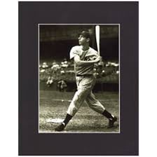 Joe DiMaggio in a baseball uniform at bat.