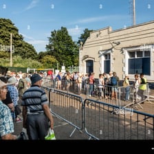 People waiting in a long line during a delay