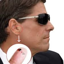 An undercover person wearing a concealed microphone