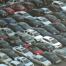 A car parked in a marked parking lot.