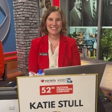Presenters taking donations during a televised charity fundraising event