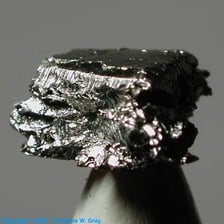 A sample of iridium metal, a dense silvery chemical element.