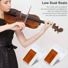 A violin bow being rubbed against a block of rosin