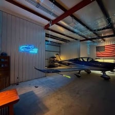 An aircraft hangar containing an airplane.