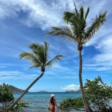 A traveler relaxing on a beach during a vacation