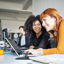A professional working at a desk as part of a career.