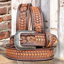 A leather belt decorated with an embossed, tooled pattern.