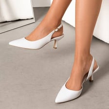 A pair of shoes with short, slender kitten heels.