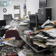 A cluttered desk showing a disorderly arrangement