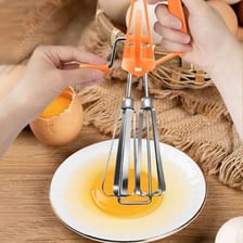 Handheld egg beaters used as kitchen whisk utensils