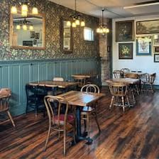 Interior of a familiar neighborhood pub where people regularly gather