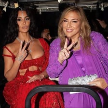 A person conspicuously displaying expensive jewelry at a party
