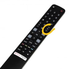 A handheld television remote control being used to change channels.