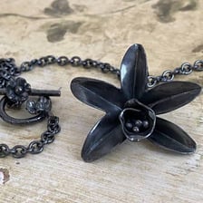 A finely crafted piece of jewelry showing exceptional detail.