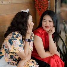 Two women having a private conversation