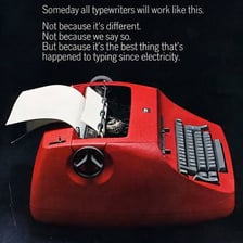 An IBM Selectric typewriter with paper inserted for typing.
