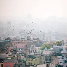Hazy, polluted air hanging over a city skyline.