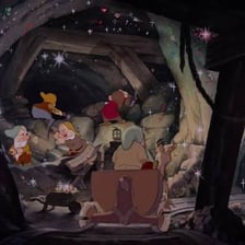 The Seven Dwarfs working inside their mine.
