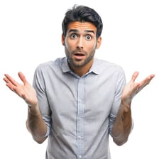 A person looking both surprised and bewildered by a puzzling situation.