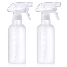 A narrow jet of water spraying from a bottle