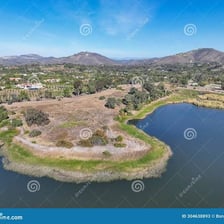 A large reservoir holding water behind a dam