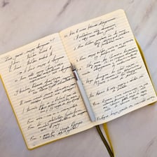 An open notebook used as a personal journal.