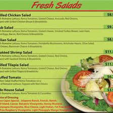Several prepared salads presented as menu dishes