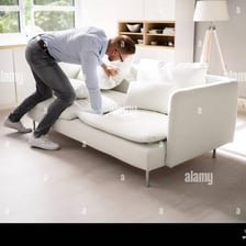 A person looking for keys that have been misplaced in a home