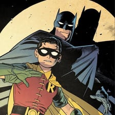 Batman and Robin depicted wearing superhero capes.