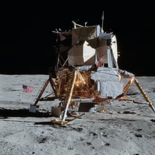 An Apollo lunar module standing on the Moon.