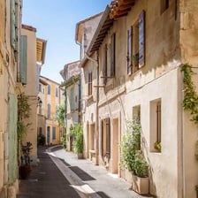 A sunny summer street scene in Arles, France