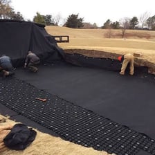 A sand trap on a golf course.
