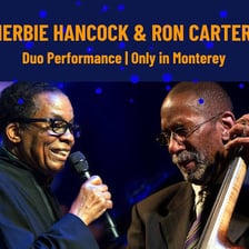 Two musicians performing together as a duo.
