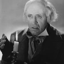 Alastair Sim portraying Ebenezer Scrooge