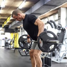 A person performing a weightlifting exercise