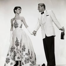 A person wearing polished, stylish formal clothing.