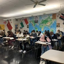 High-school students taking a standardized test in a classroom