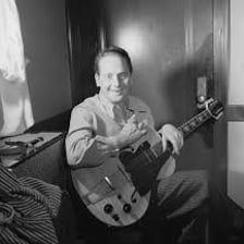 Les Paul performing with an electric guitar