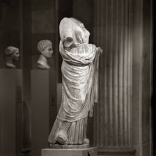 A classical statue representing one of the Greek Muses.