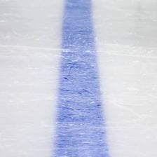 An ice hockey rink with its blue line clearly visible