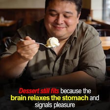 A person looking tempted by an appealing dessert display