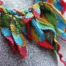 A colorful feather boa worn as a neck accessory.