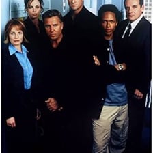 Forensic investigators working in a crime laboratory from a television crime drama